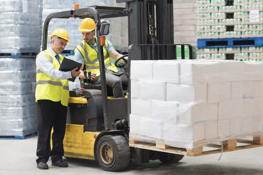 Warehouse Manager Talking To Fork Truck Driver | Model Logic Ltd